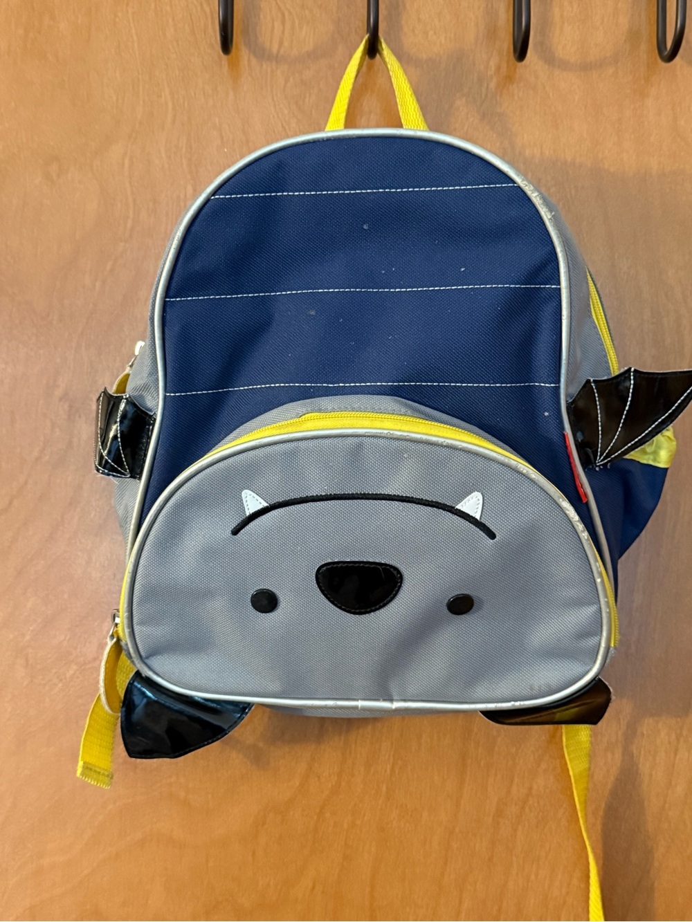 Skip Hop Navy and Gray Kids Backpack with Yellow Accents - Bat Face